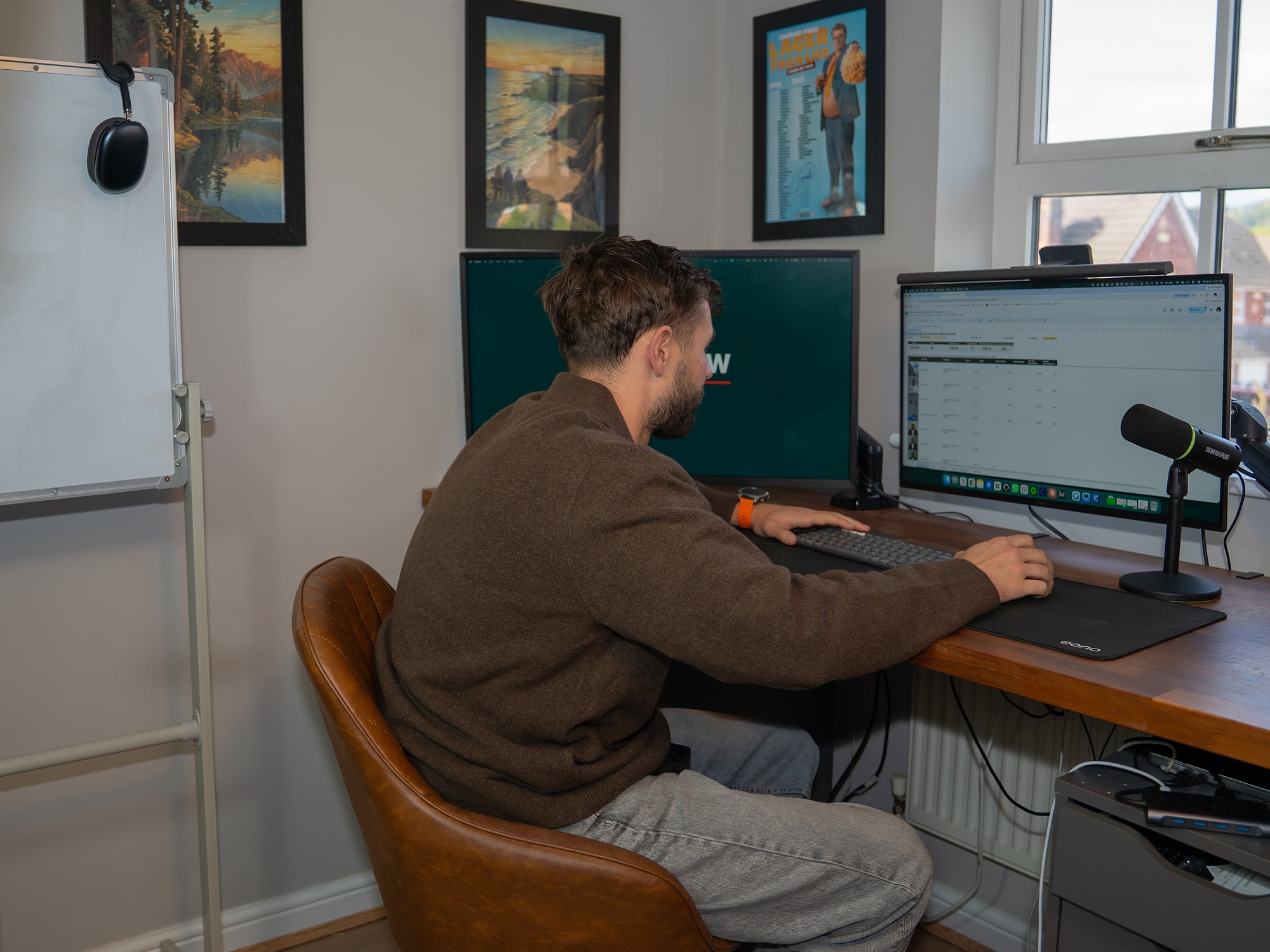Luke Watkins at his desk in the Social Flow office